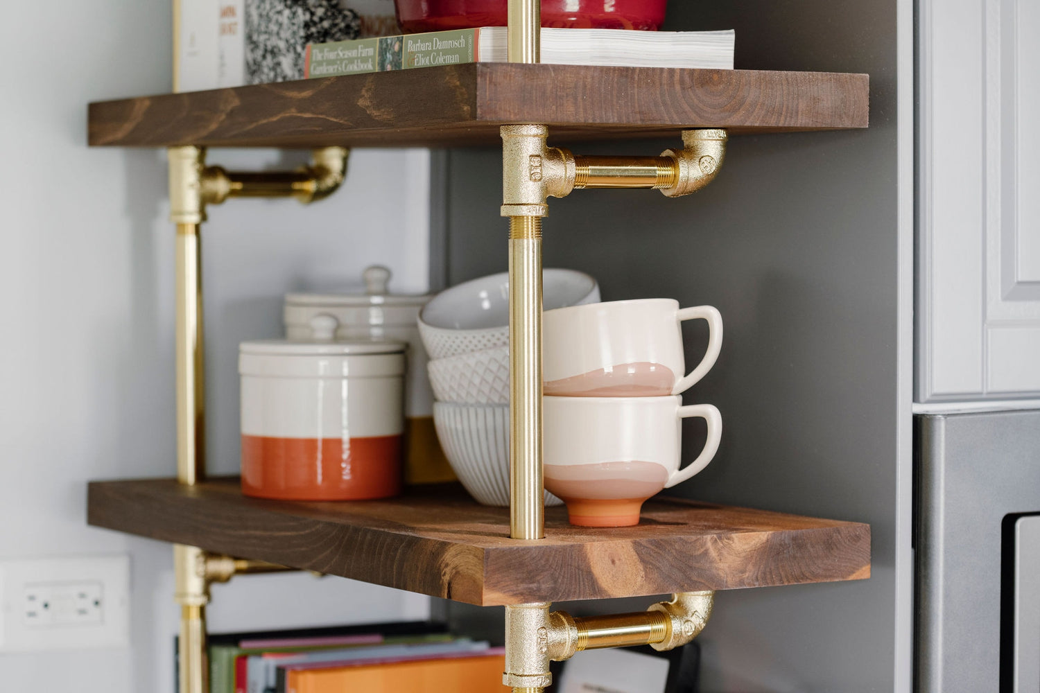 close up photo of brass plated pipes and walnut shelves | Soil & Oak