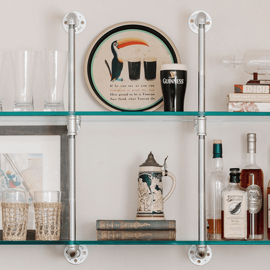 close up chrome plated pipes and glass shelves | Soil & Oak 