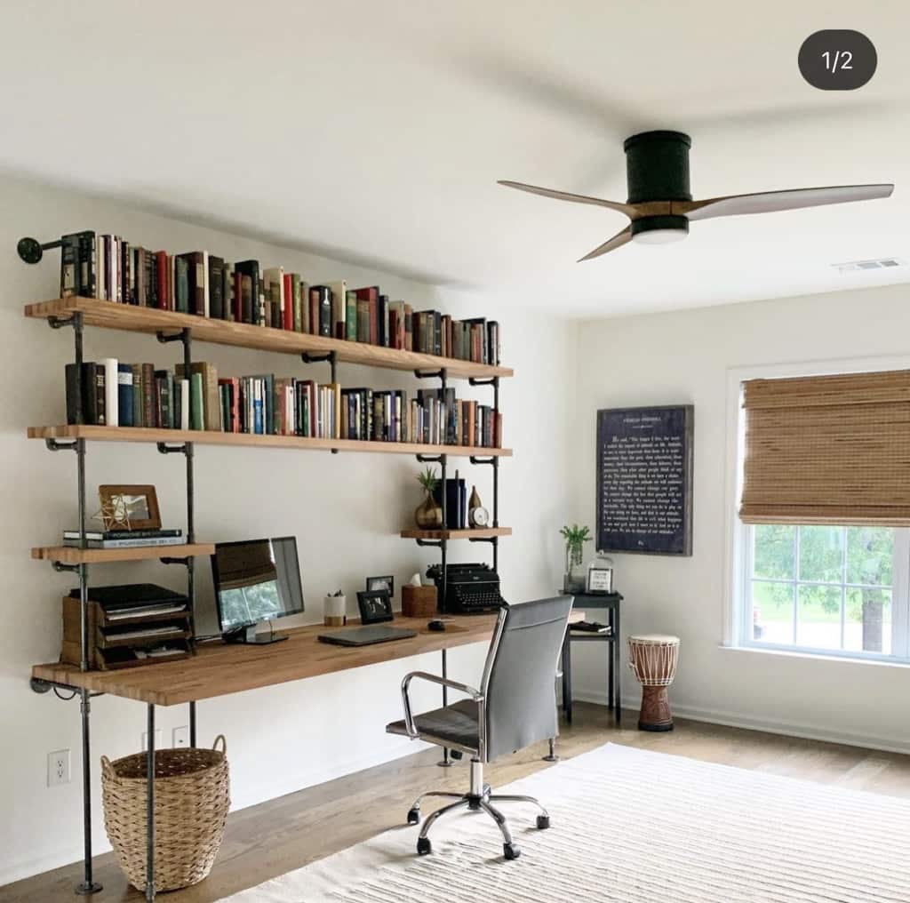built-in desk bookshelves unit with black matte pipes and oak butcher block shelves | Soil & Oak