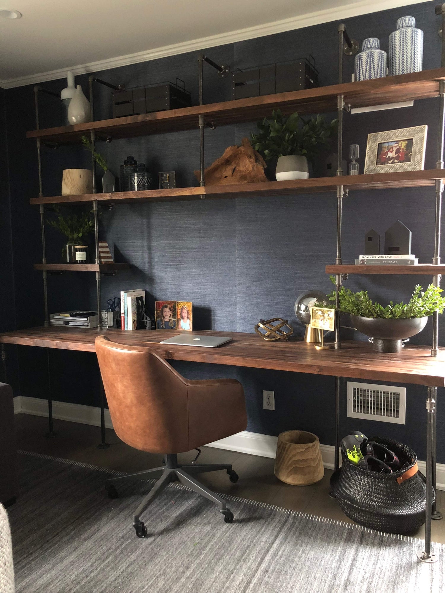 built-in desk bookshelves with American walnut butcher block shelves and black pipes | Soil & Oak 