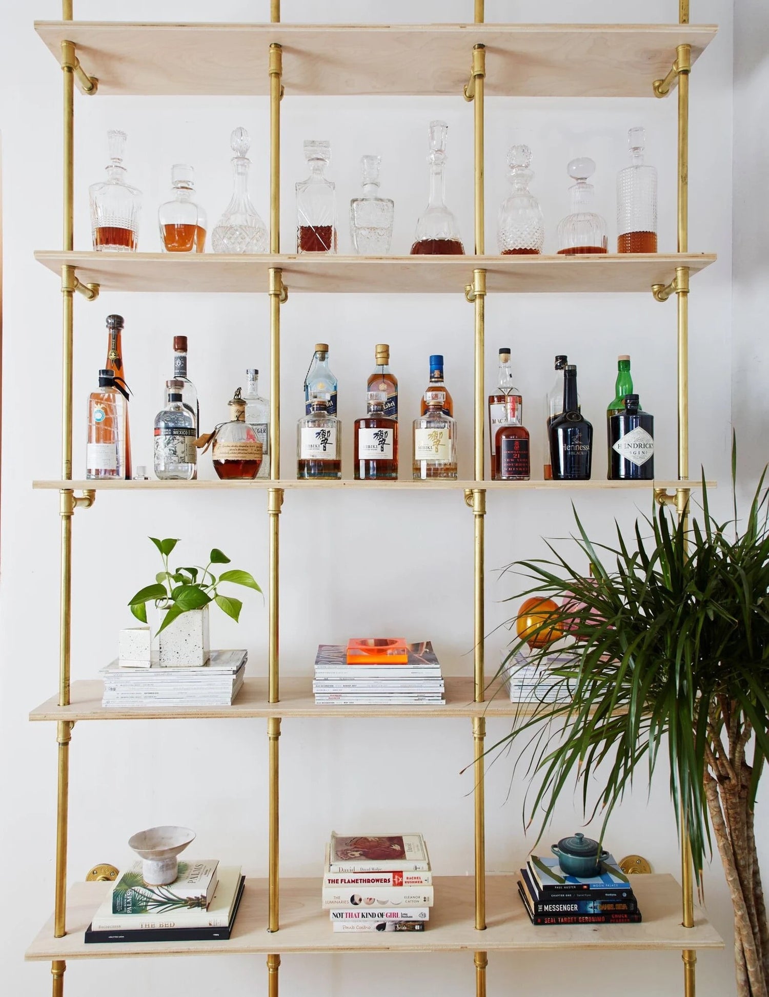 Plywood bookshelves with brass plated pipes | Soil & Oak