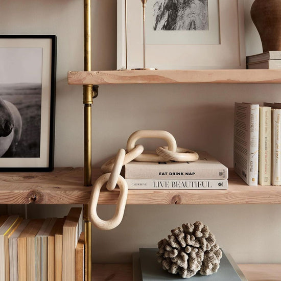 Close up photo of whitewashed Douglas fir shelves and brass plated pipes | Soil & Oak
