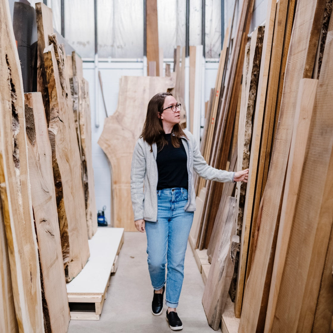 Caroline Coolidge hand picking quality wood for soil and oak shelves | Soil & Oak