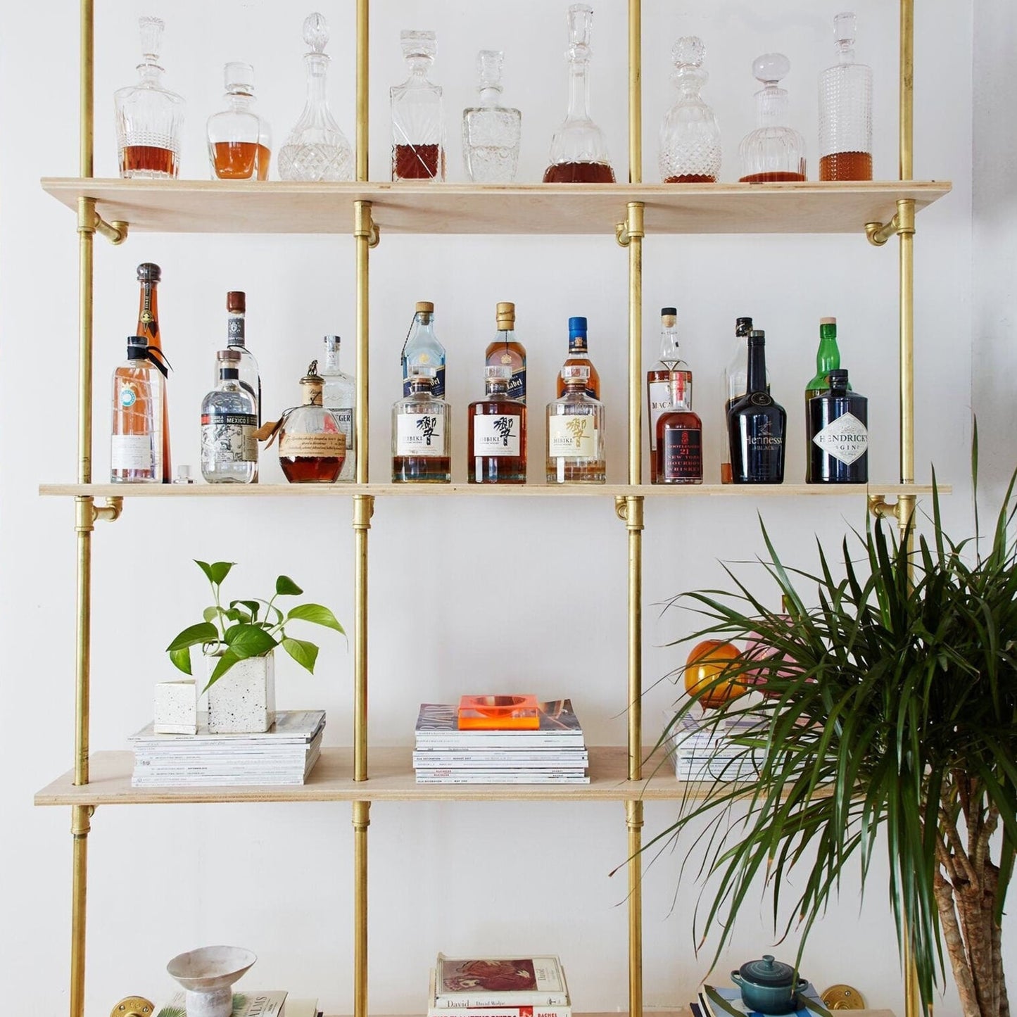 custom bookshelf with brass plated pipes and birch plywood shelves in natural finish | Soil & Oak