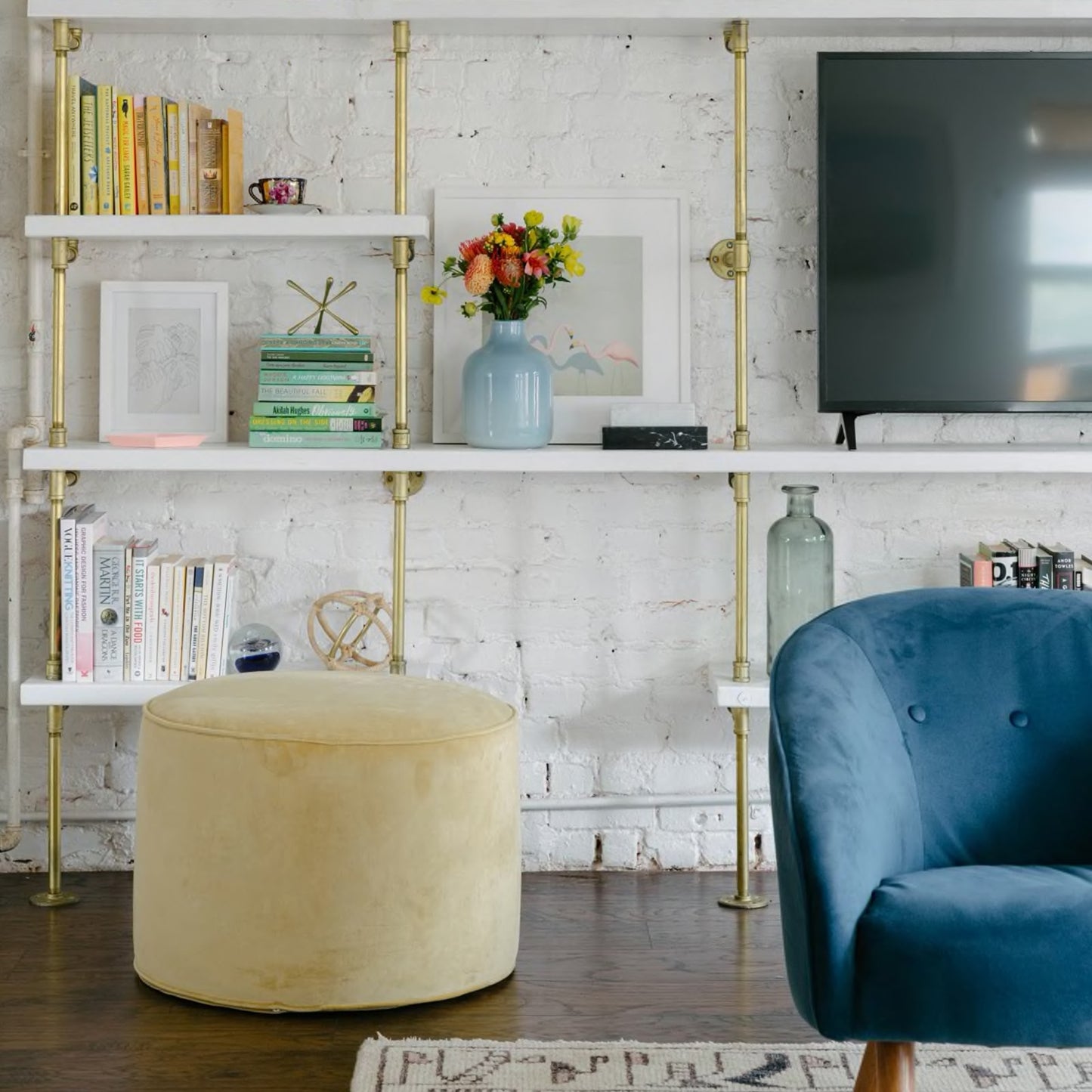 close up of brass plated pipe with white painted wood shelves | Soil & Oak