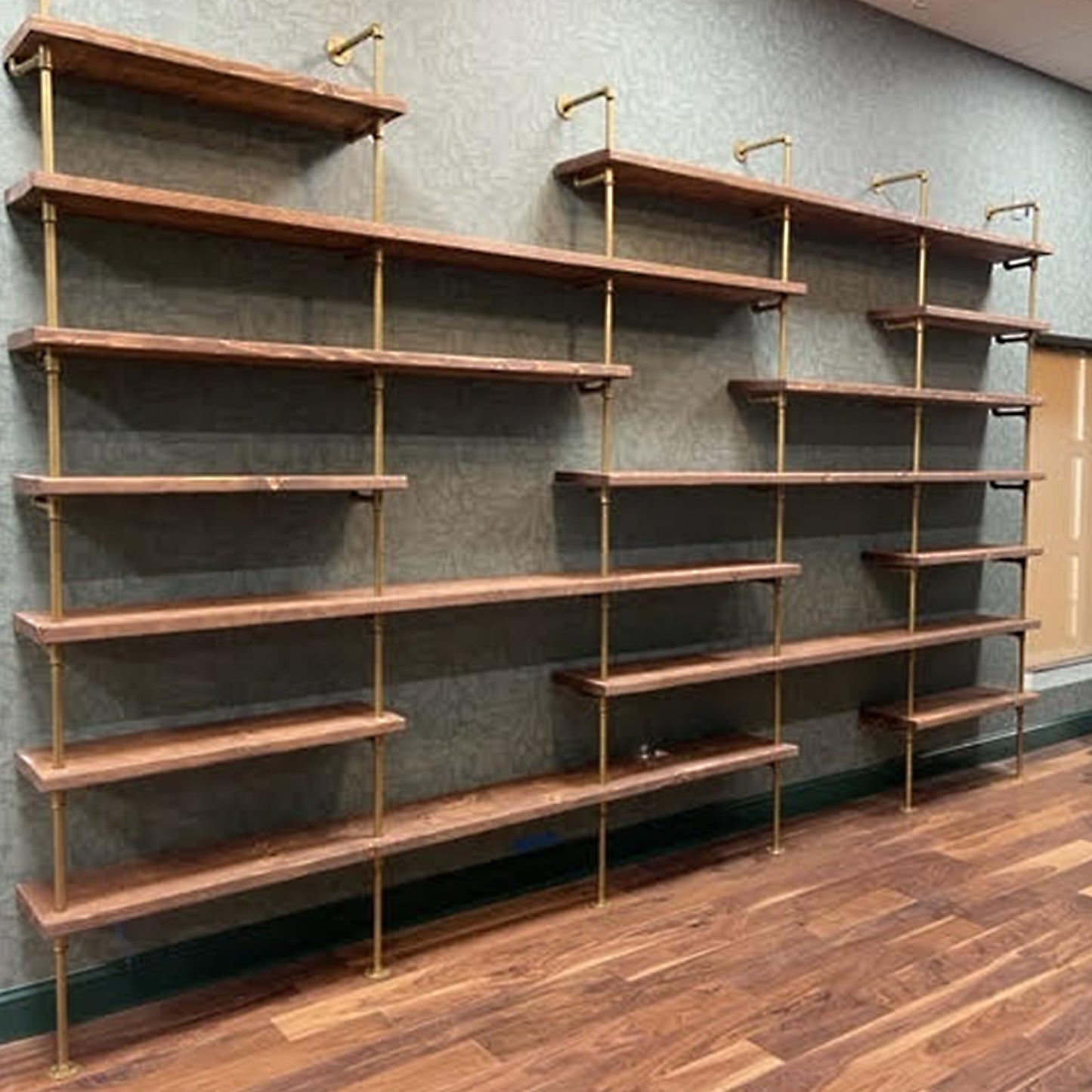 wide shot of empty shelves made from brass plated pipe and American walnut butcher block | Soil & Oak
