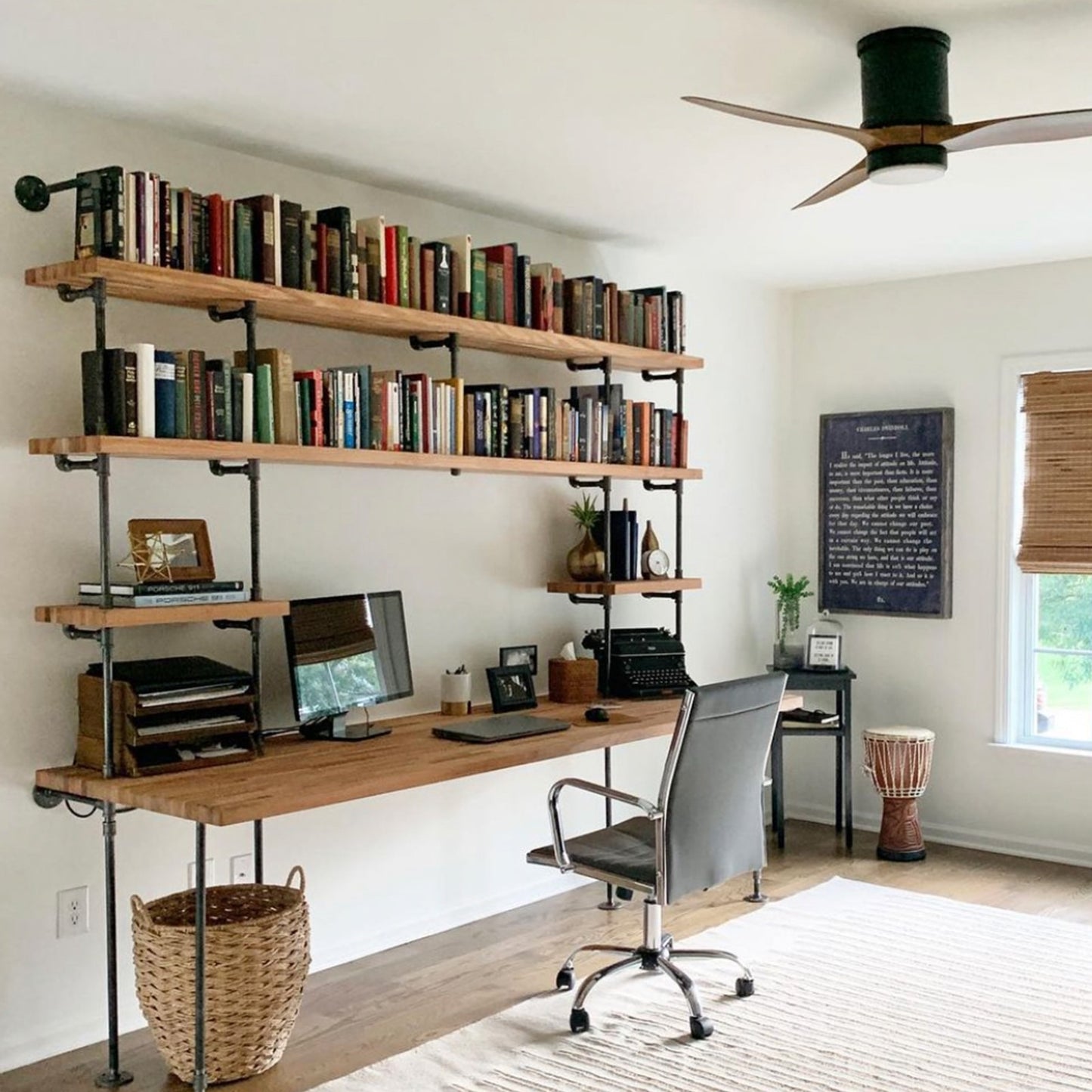 built-in desk with black steel pipes and oak wood shelves in a home office | Soil & Oak