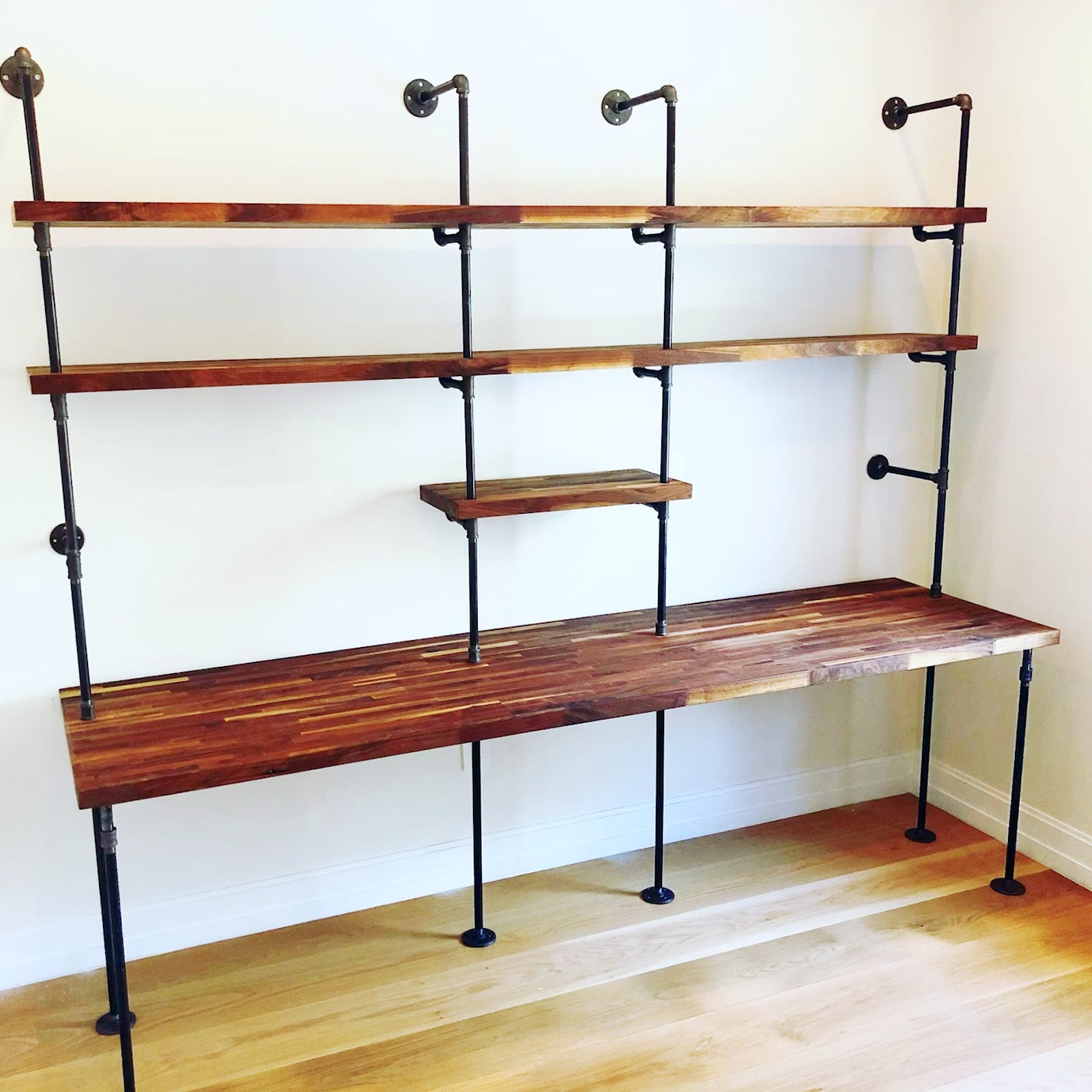 double built-in desk with black pipes and American walnut butcher block shelves | Soil & Oak