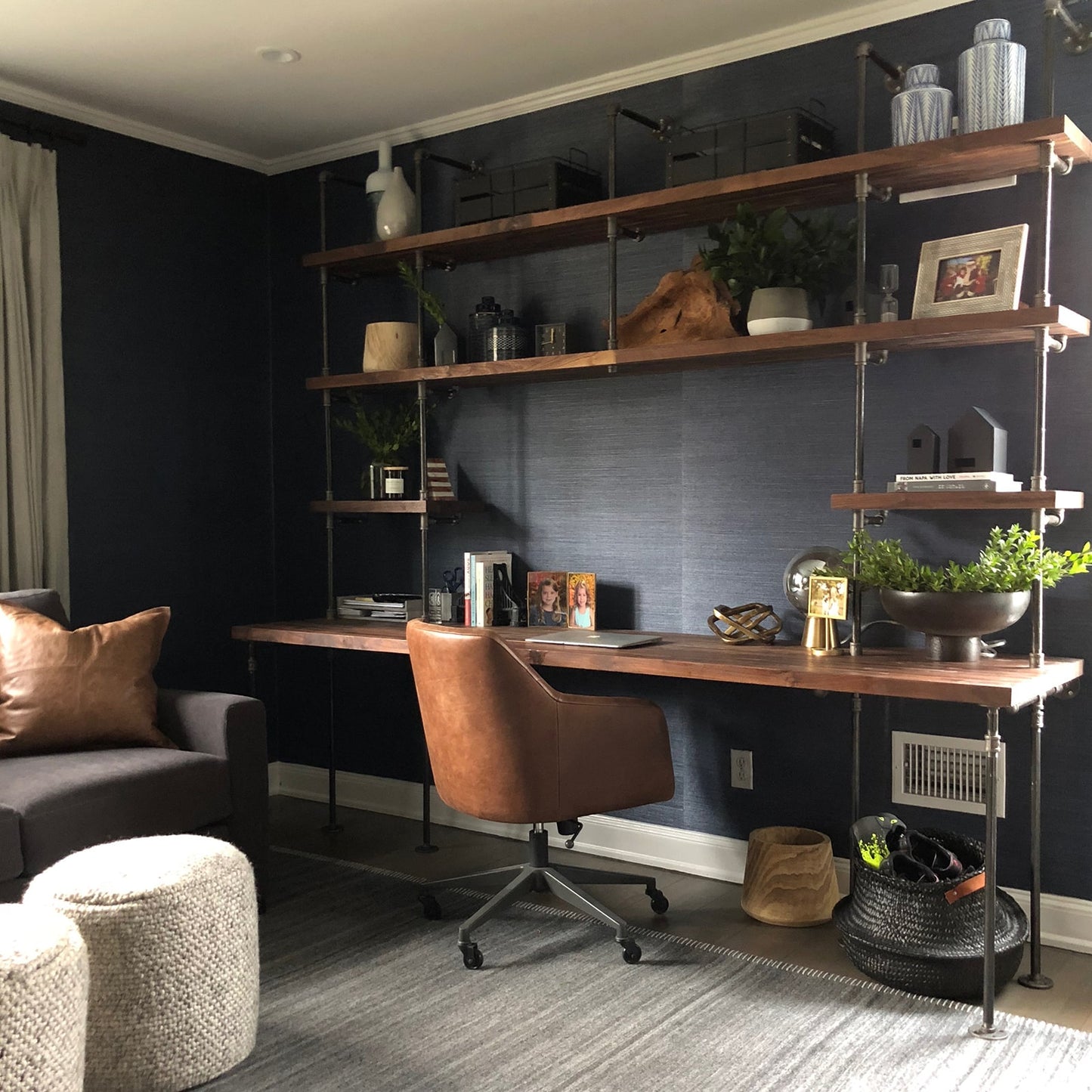 built-in desk with black steel pipes and American walnut wood shelves in a home office | Soil & Oak