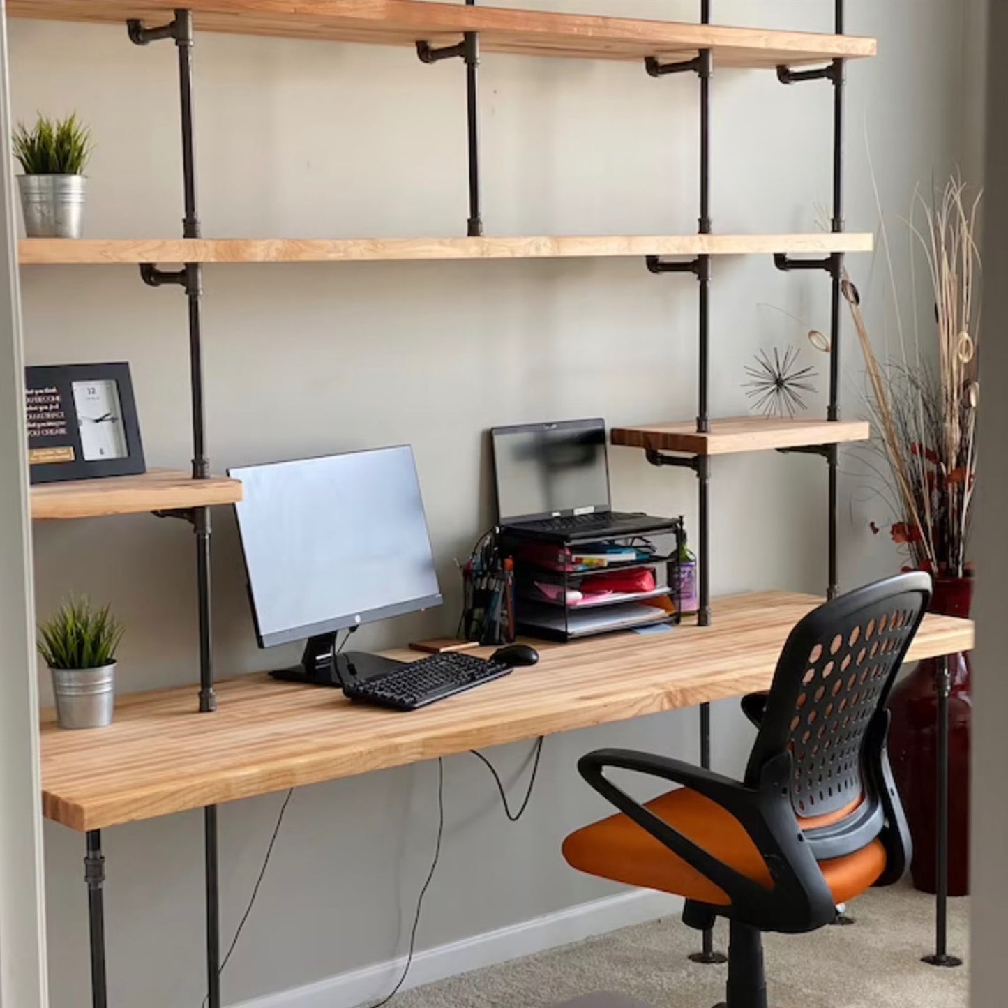 built-in desk with black steel pipes and oak wood butcher block shelves in a home office | Soil & Oak