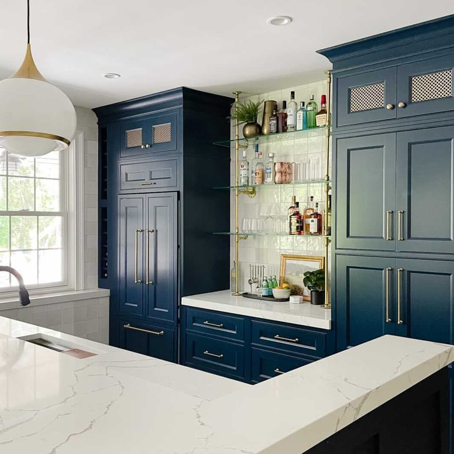 counter to ceiling shelving with brass plated pipes and glass shelves in kitchen | Soil & Oak
