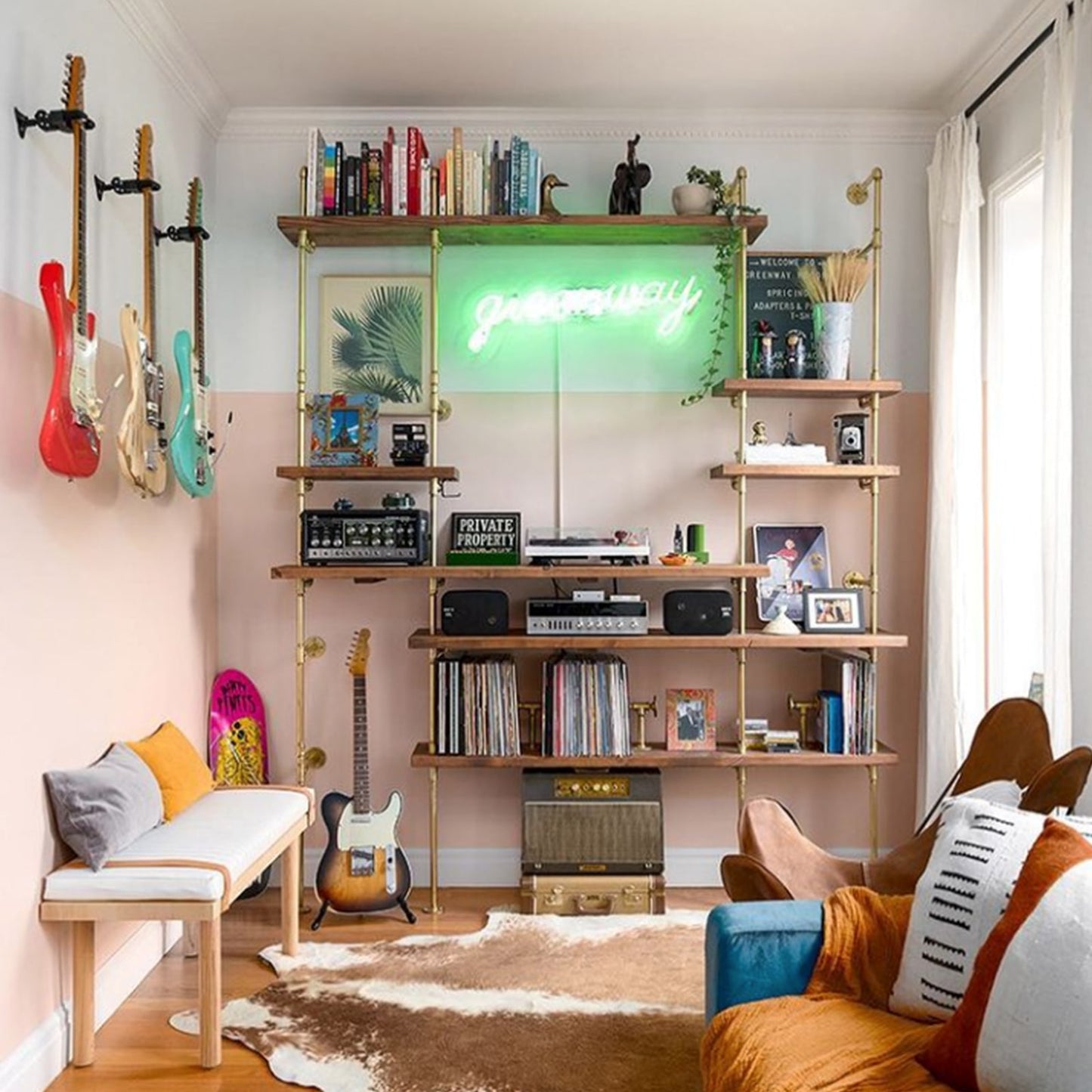 custom bookshelf with brass plated pipes and oak shelves in music room | Soil & Oak