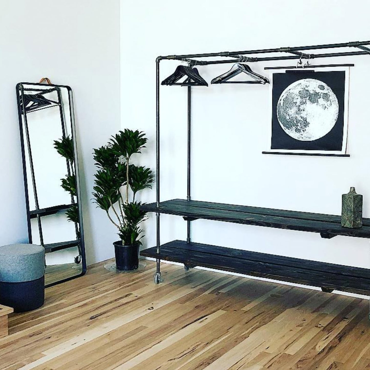 empty custom black clothing rack for brick and mortar retail store | Soil & Oak