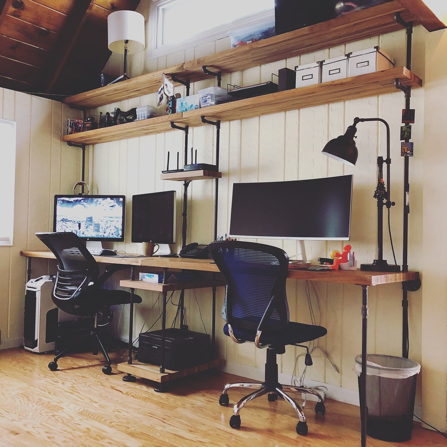 custom double built-in desks with black pipes and oak shelves | Soil & Oak