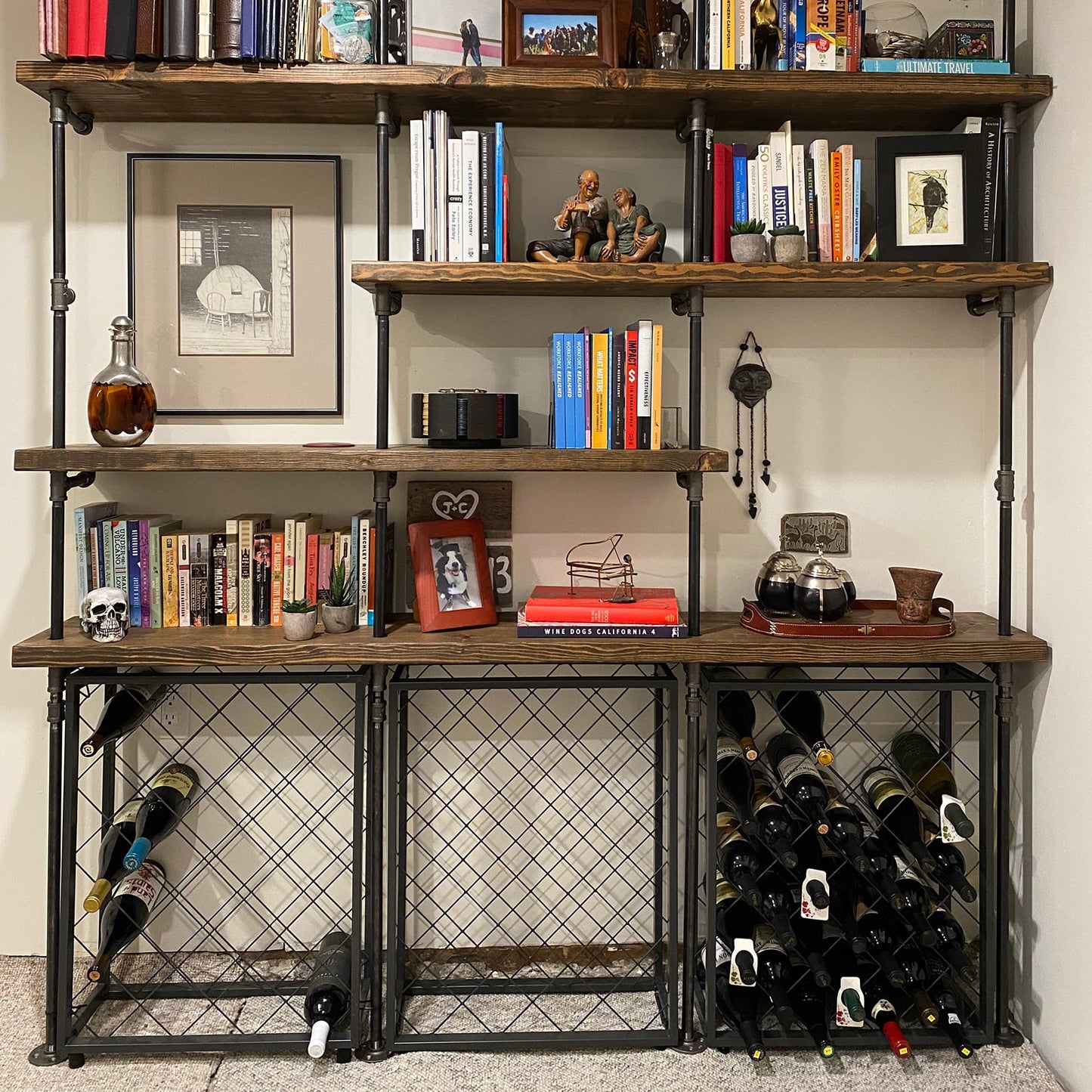 custom shelving unit with black pipes and dark stained wood shelves | Soil & Oak