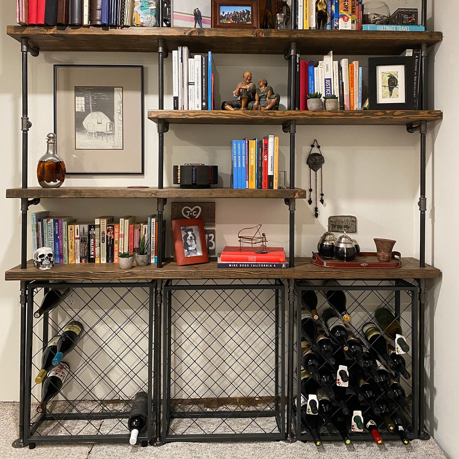 custom shelving unit with black pipes and dark stained wood shelves | Soil & Oak
