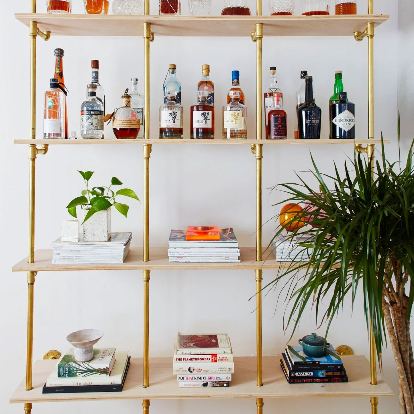 Bookshelf with brass plated pipes and raw birch plywood | Soil & Oak