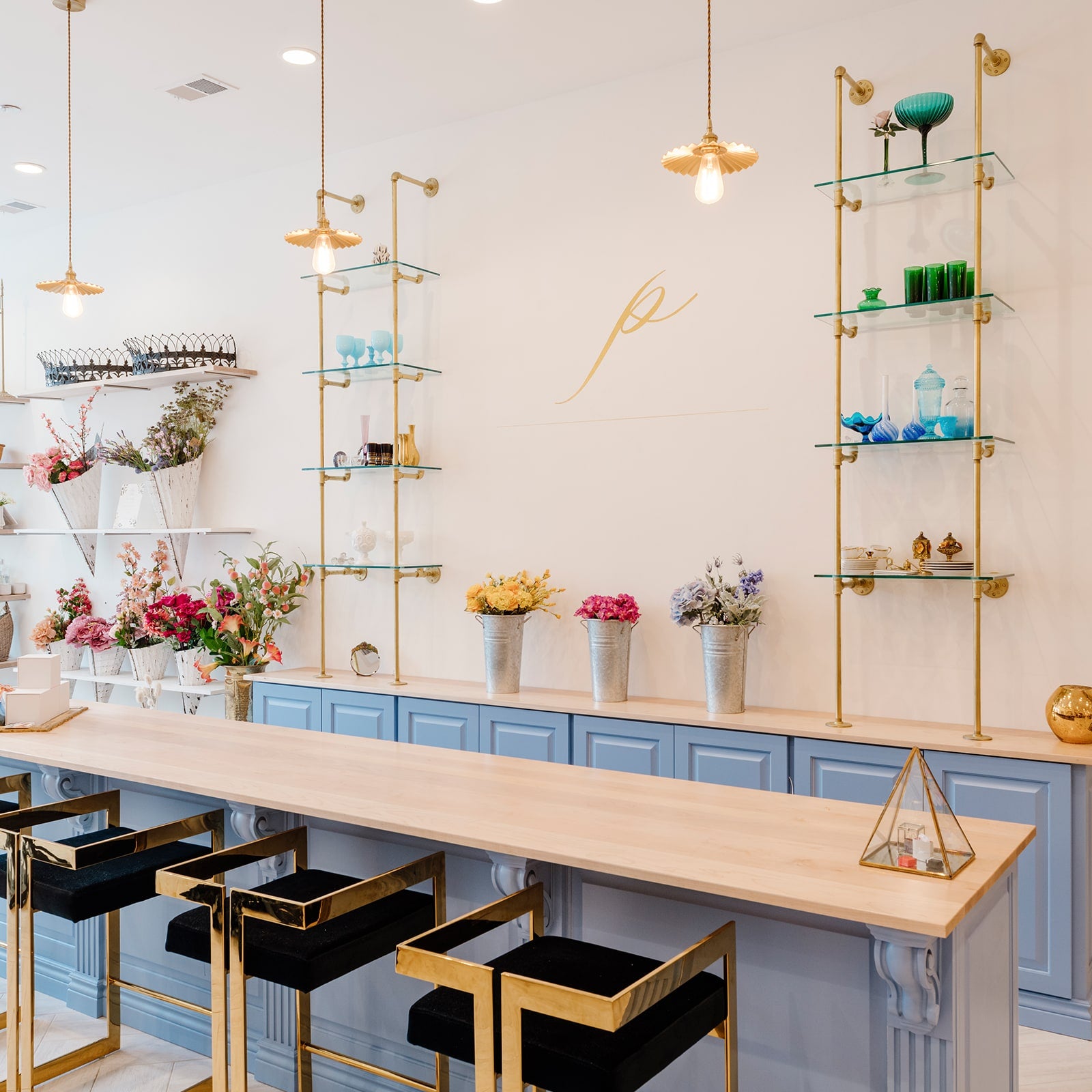 custom retail shelving units with brass plated pipes and glass shelves | Soil & Oak
