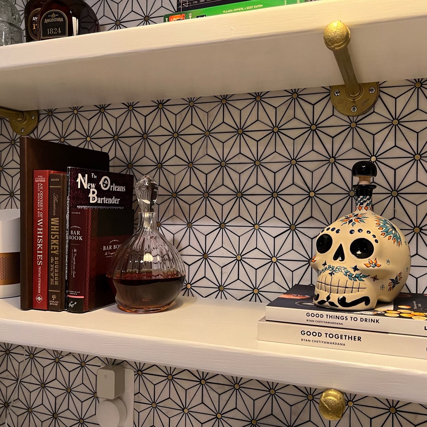 close up soil & oak brass plated wall mounts with white shelves