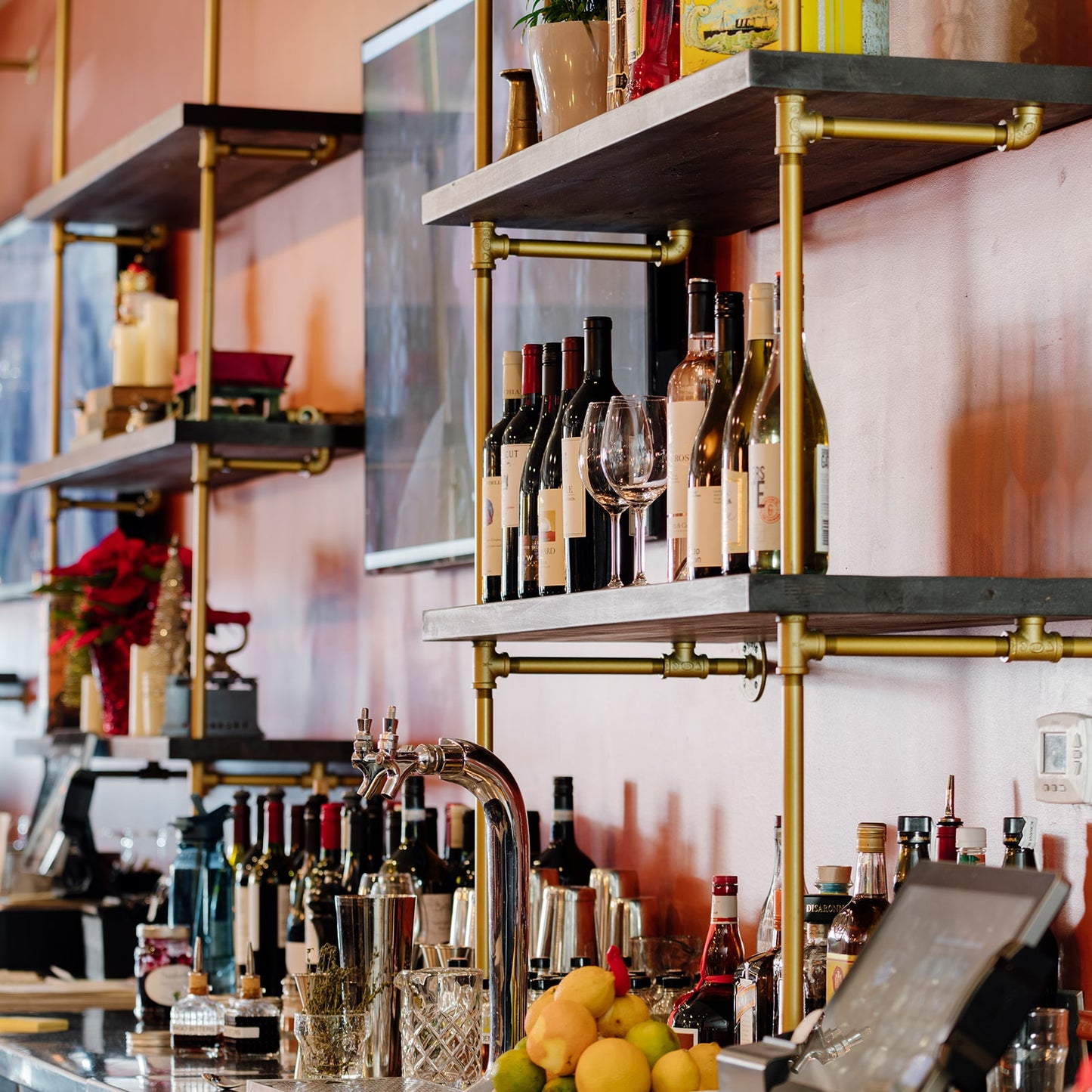 custom black bar shelves with brass plated pipes | Soil & Oak