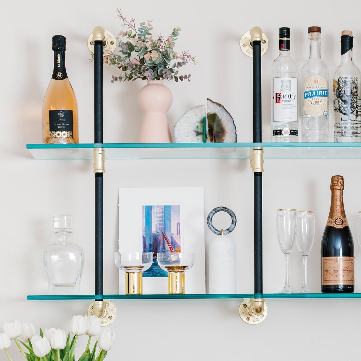 Wall mounted shelving with black pipes with brass fittings and glass shelves | Soil & Oak