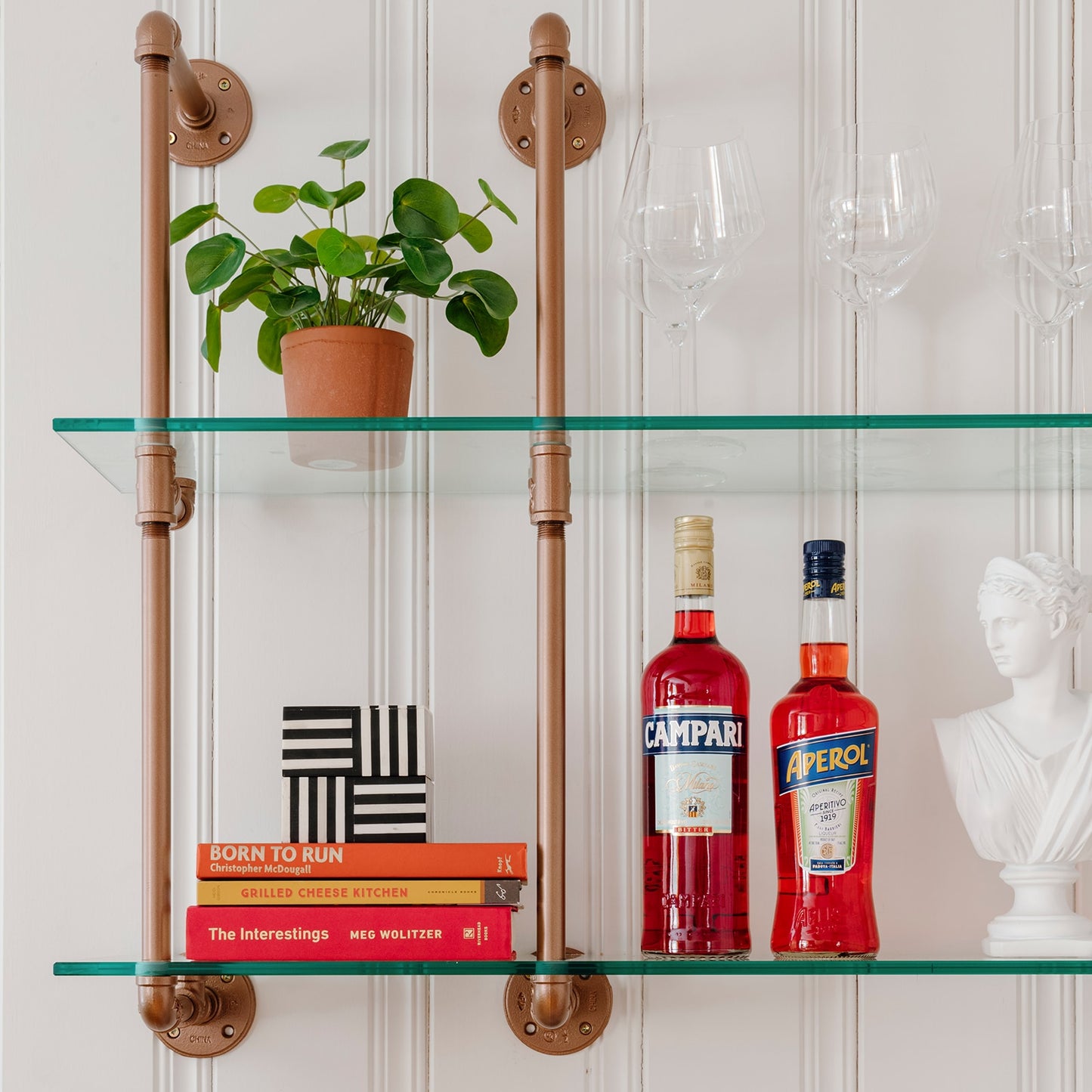 kitchen and bar wall mounted shelving with coper pipes and glass shelves | Soil & Oak