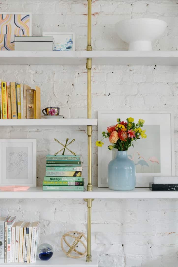 Bookshelves brass plated pipes with white painted shelves | Soil & Oak