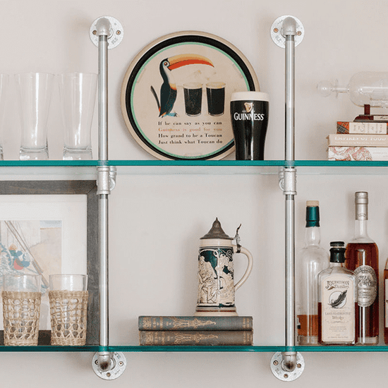 close up chrome plated pipes and glass shelves | Soil & Oak
