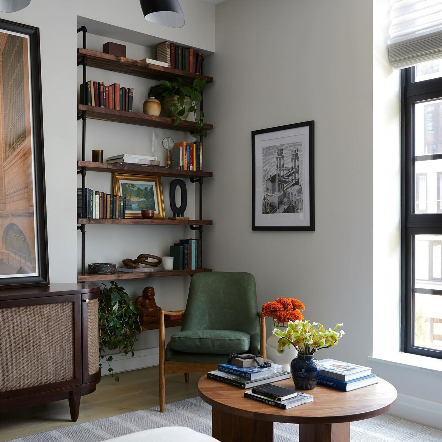 custom bookshelf with black pipes and oak shelves in living room | Soil & Oak