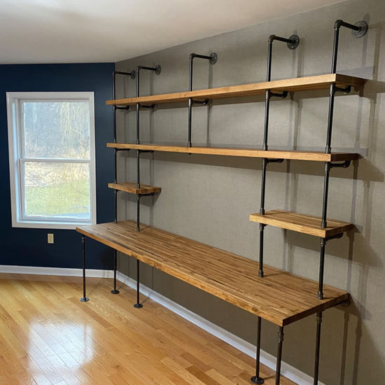 Oak butcher block shelves on a built-in desk unit with black pipes | Soil & Oak
