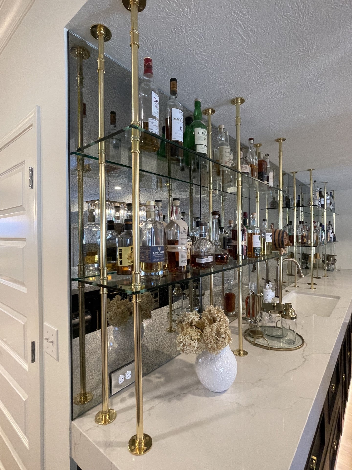 Glass and gold bar shelves | Soil & Oak