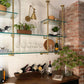 Ceiling to wall bar and kitchen shelving with brass plated pipes and glass shelves | Soil & Oak