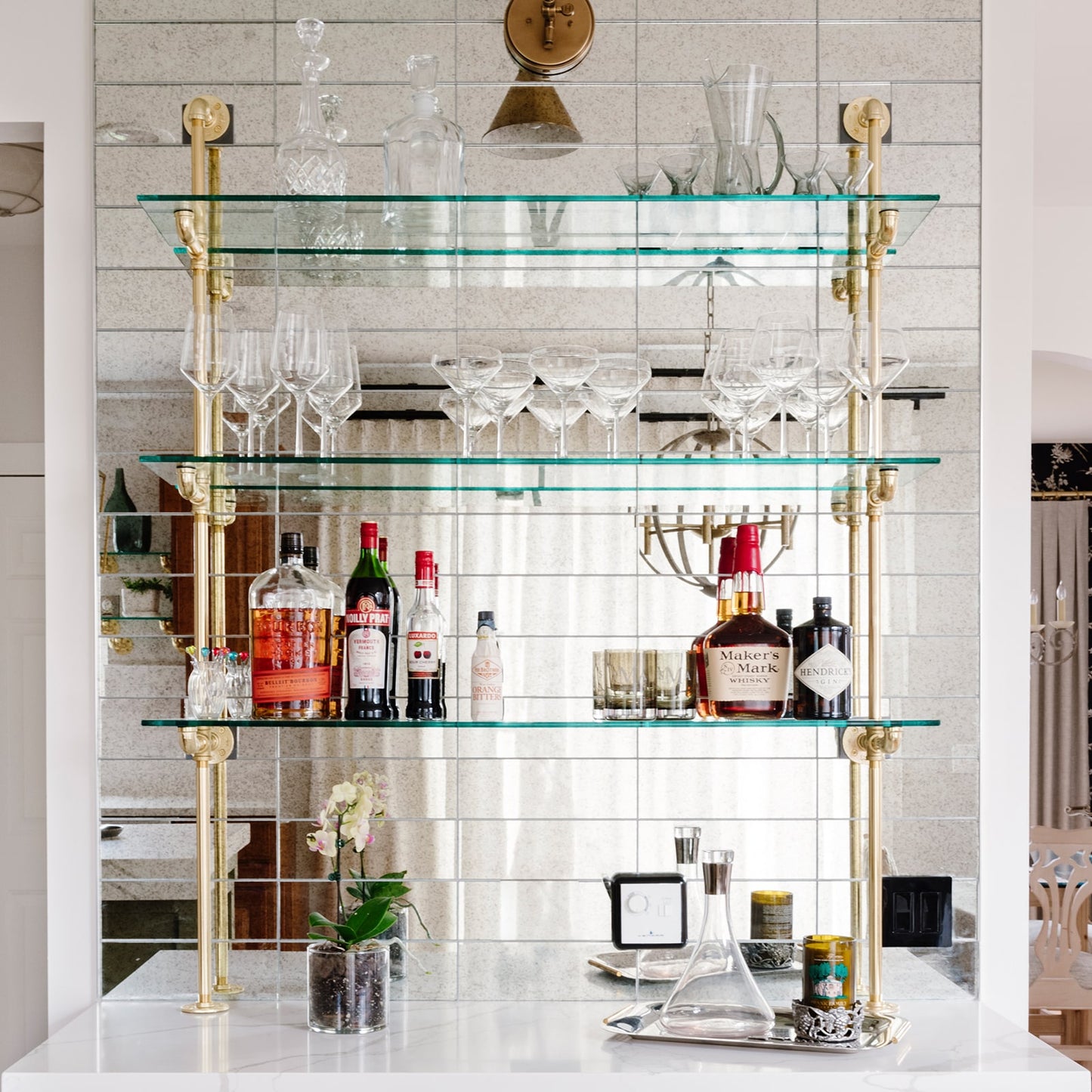 soil & oak counter to wall unit with brass plated pipes and glass shelves