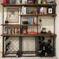 custom shelving unit with black pipes and dark stained wood shelves | Soil & Oak 