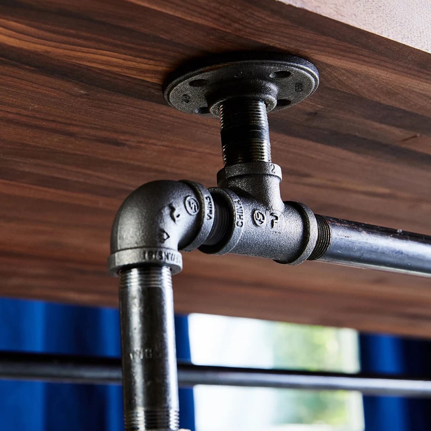 Close up of black steel pipe under the table top | Soil & Oak