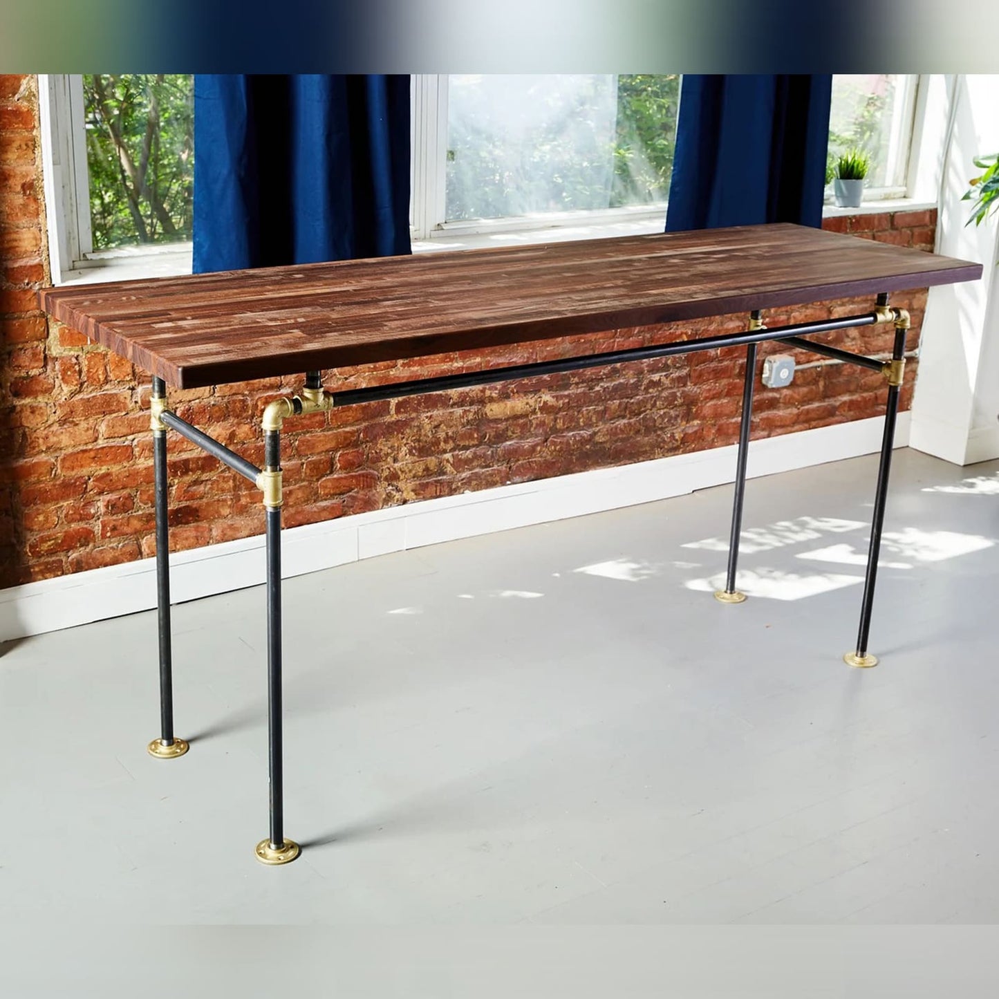 Standing desk with black pipe legs and brass fittings and walnut butcher block | Soil & Oak