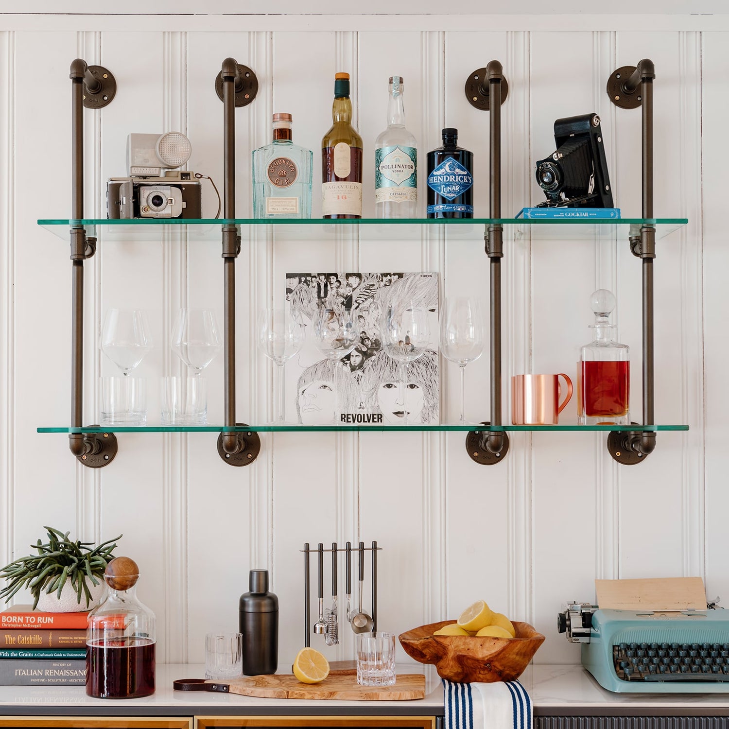 Kitchen and bar wall mounted glass shelves with oil-rubbed bronze powder coated pipes | Soil & Oak