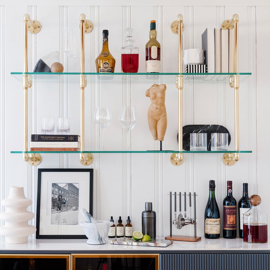 kitchen and bar wall mounted shelving with brass plated pipes and glass shelves | Soil & Oak 
